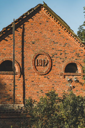 A brick house built in 1912, stands somewhere in the villageの写真素材