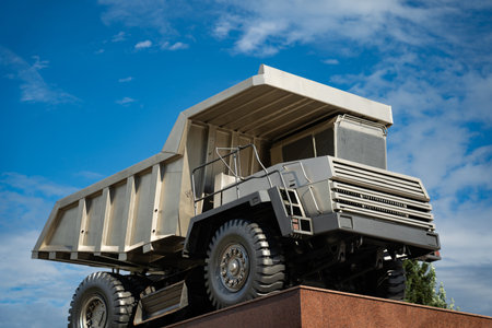 A statue of a huge, quarry dump truck in the cityの写真素材