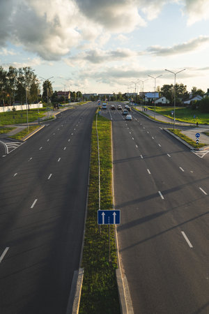 Highway in the evening view from the bridge down. Evening city, motorway