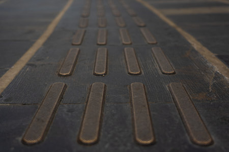 Blind road signs affixed to block paving. Direction indicator for the disabled