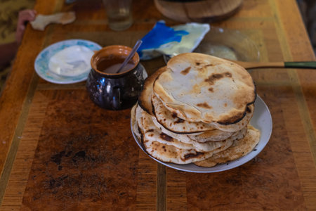 Pancakes cooked by grandma in the oven in the village. Old Slavic food