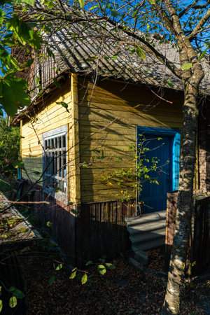 An old, rustic house in the evening in the village. Old Slavonic Houseの写真素材