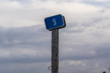 A kilometer marker by the road.の写真素材