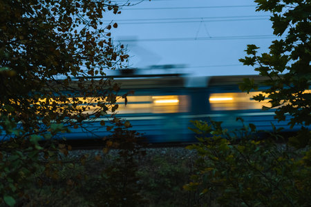 The electric train goes fast in the evening. Long exposure, lubricationの写真素材
