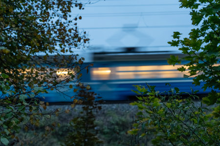The electric train goes fast in the evening. Long exposure, lubrication