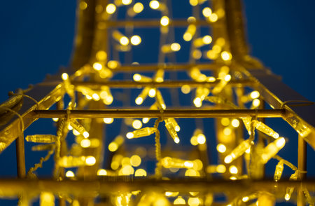 Christmas garland on the street in close-up. Yellow glowの写真素材