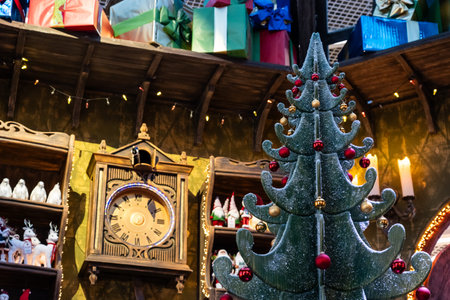 New Year decorations. Christmas tree. Gifts on the shelves. An old watch