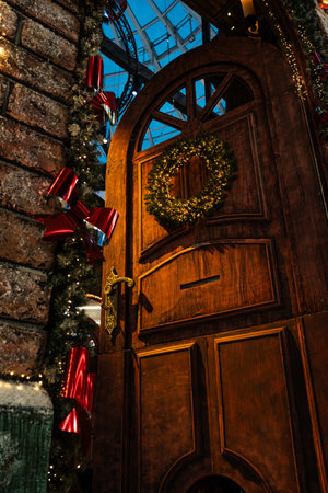 The huge door is decorated with a Christmas wreath. New Years backgroundの写真素材
