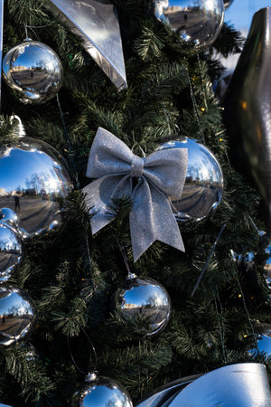 Christmas decorations on the branches of the tree. A bow on the Christmas tree. High quality photoの写真素材
