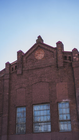 The facade of an old, abandoned factoryの写真素材