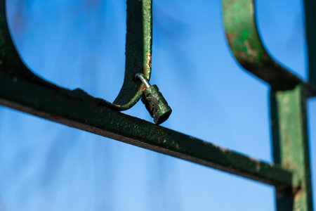 Iron, old handrails with a lock on them. Love lock on the railing. High quality photo