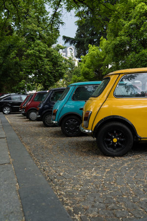 A bright yellow, small car stands in a parking lot in Batumi, Georgia. High quality photoの写真素材