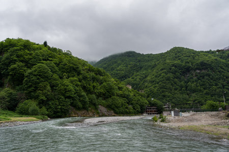 Wide against the background of the Georgian mountains, cloudy sky. High quality photo