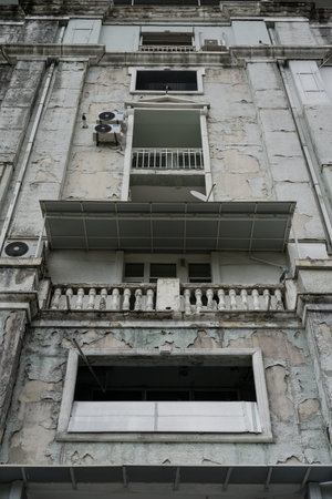 The old shabby facade of a building in Batumi. High quality photo