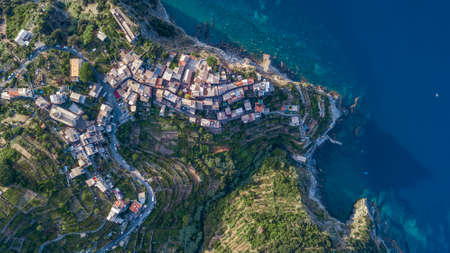 Overhead aerial view of Corniglia on the montain in the morning sunshine in Cinque Terre, Italyの写真素材