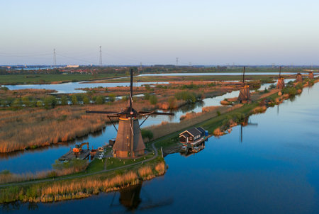 Drone view of Kinderdijk Wind Mills during sunset in rural Rotterdam area in Netherlandsの写真素材