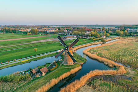 Aerial drone shot view of Kinderdijk Wind Mills in the filed near Rotterdam in Netherlandsの写真素材