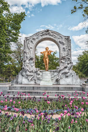 Vienna, Austria - April 28, 2019: Mozart Gold Statue in Mozart Memorial Parkのeditorial素材