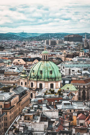 View of Peterskirche dome from the top of Stephansdom in the historic old town of Vienna, Austriaの写真素材