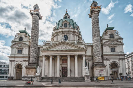 Vienna, Austria - April 28, 2019: Locals walk by Karlskirch Cathedral in a sunny dayのeditorial素材