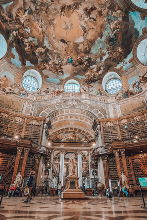 Vienna, Austria - April 28, 2019: Statue of Emperor Charles VI at Prunksaal in the center of the old imperial libraryのeditorial素材