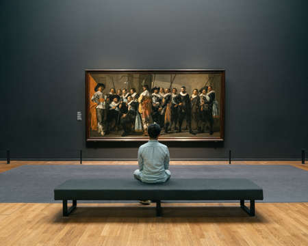 Amsterdam, Netherlands - July 20, 2019: Art lover admire the painting in Rijksmuseumのeditorial素材
