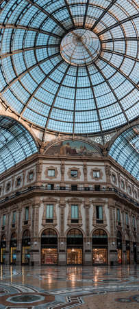 Milan, Italy - August 3,2019: Facade of boutiques and top dome in Galleria Vittorio Emanuele, near Milano Duomoのeditorial素材