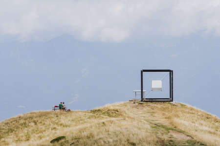 Ticino, Switzerland - August 5, 2019: Art sculpture suspended Cube by Jaya Schurch on top of Monte Tamaroのeditorial素材
