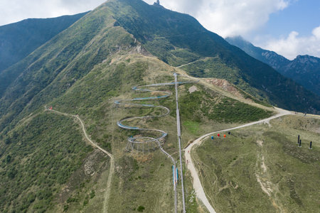 Aerial drone shot view of Alpine Coaster Bobsleigh track on Monte tamaro hills in Ticino,...