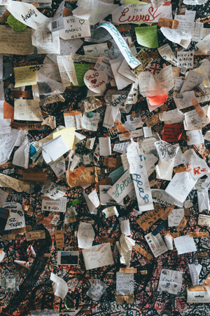 Verona, Italy - August 7, 2019: Love notes stuck on the walls of the Casa di Giulietta