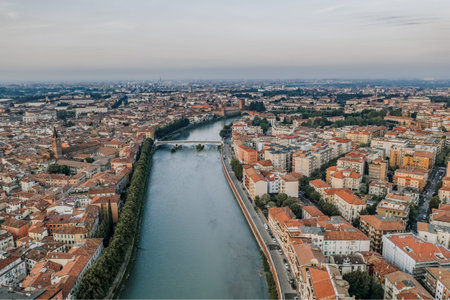 Aerial overhead drone shot view of verona city with adige river during sunriseの写真素材