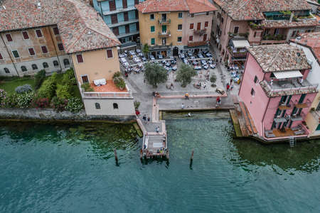 Malcesine, Italy - August 7, 2019: Aerial drone shot of village port in Malcesineのeditorial素材