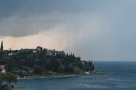 Village malcesine with heavy storm rain in summer timeの写真素材
