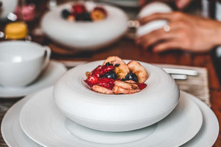 Home made brunch with food in unique porcelaine plateの写真素材
