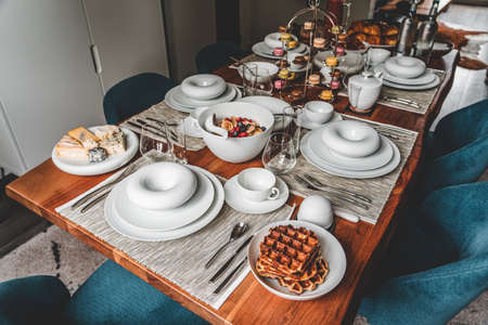 Home made brunch with food in unique porcelaine plateの写真素材