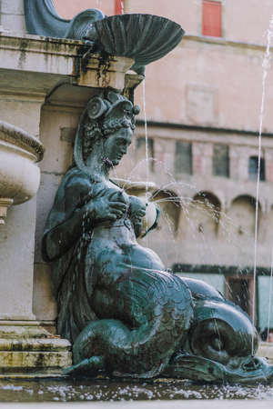 Bologna, Italy - August 8, 2019: Lactating nereid of the fountain of neptune in city square, piazza del nettunoのeditorial素材