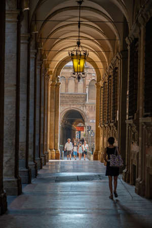 Bologna, Italy - August 8, 2019: Peple walk in portico passage with roman style columnsのeditorial素材