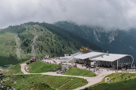 Monte Baldo, Italy - August 8, 2019: Tourists walk to Funiculare cable car on top of Monte Baldo in...