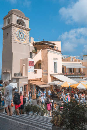 Capri, Italy - August 13, 2019: Tourists in city center square Piazza Umberto in early morningのeditorial素材