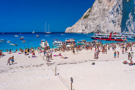 Zakynthos, Greece - August 20, 2019: Aerial drone shot of tourists on Zakynthos Shipwreck Navagio beachのeditorial素材