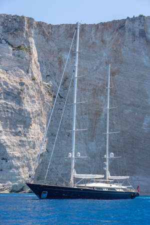 Luxury yacht parked in Ionian sea near shipwreck bay, Navagios beach in summer noonの写真素材