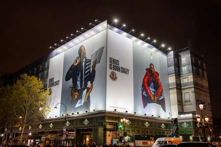 Paris, France - December 1, 2019: Big Moncler ad billboard featuring Will Smith in front of Garner Opera house in the eveningのeditorial素材