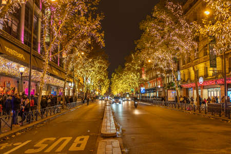 Paris, France - December 1, 2019: Boulevard Haussmann with Christmas holiday lightings on in the eveningのeditorial素材