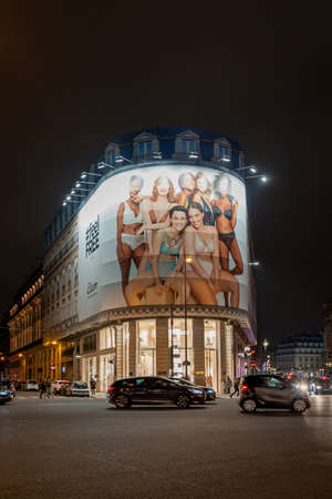 Paris, France - December 1, 2019: Etam flagship on boulevard haussmann with big billboardのeditorial素材