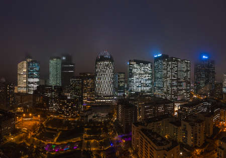Paris, France - December 5, 2019: Panoramic aerial drone night shot of skyscrapers in Paris La Defense district with Parc Diderot in foregroundのeditorial素材