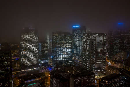 Paris, France - December 5, 2019: Aerial drone night shot of skyscrapers in Paris La Defense district with Tour D2, Total, Thales, Engie in fogのeditorial素材