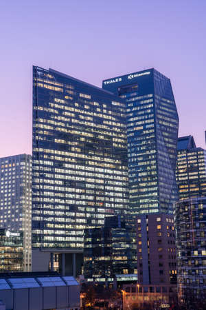 Paris, France - December 4, 2019: La Defense Skyscraper of Tour CBX, Thales, DXC Technology, after sunset in purple skyのeditorial素材