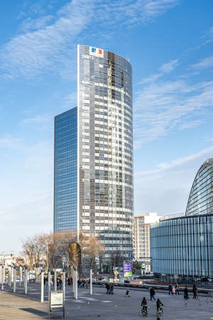 Paris, France - December 8: Parisiens walk and ride bike at foot of Tour Sequoia in La Defense before sunsetのeditorial素材