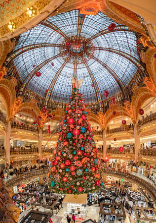 Paris, France - December 15: Massive Christmas tree decoration with flowers inside Galerie Layfayette shopping mallのeditorial素材