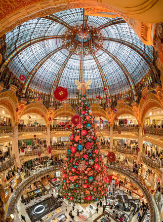 Paris, France - December 15, 2019: Massive Christmas tree decoration with flowers inside shopping mallのeditorial素材